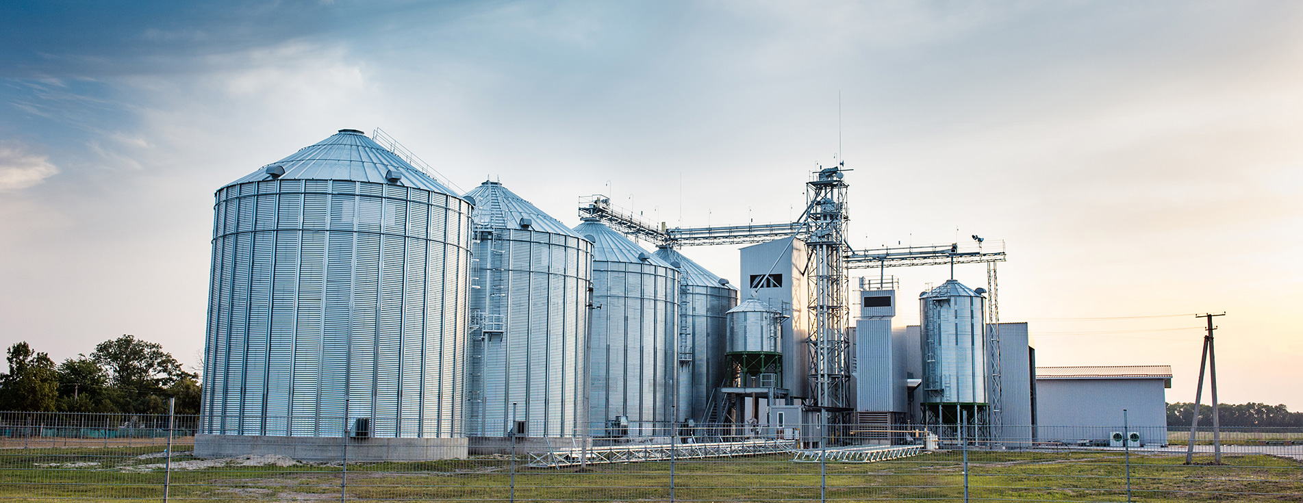 stock-photo-big-group-of-grain-dryers-complex-for-drying-wheat-modern-grain-silo-agriculture-concept-701139091_rotator.jpg